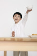Boy lifting up a bowl