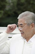 Foto: Senior man smiling while looking away Senior man smiling while looking away