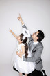 Man and girl pointing upwards