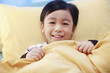 Photo: Boy lying in bed Boy lying in bed