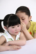 Photo: Girl whispering to her friend Girl whispering to her friend
