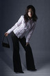Woman posing with handbag