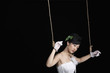 Woman puppet tied with rope