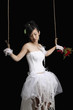 Woman puppet tied with rope