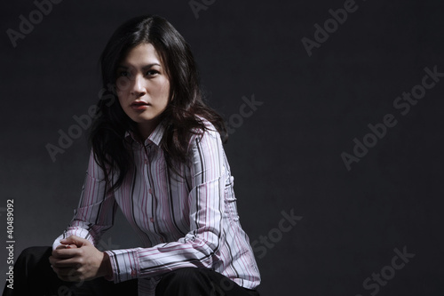 Photo: Woman posing for the camera Woman posing for the camera