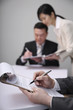 Businessman going through document before signing it