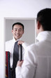 Foto: Businessman choosing necktie Businessman choosing necktie