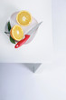 Photo: Two halved oranges and knife on a plate Two halved oranges and knife on a plate