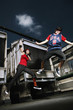Young man and woman jumping up high