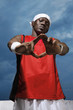 Man in sports clothing showing hand gesture
