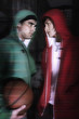 Two men with hooded sweater looking at each other