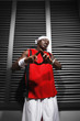 Man in sports clothing showing hand gesture