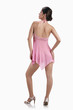 Woman in pink multi-fibre halter-neck chemise