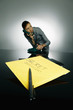 Photo: Secret envelope in the foreground with businesswoman talking on the phone in the background Secret envelope in the foreground with businesswoman talking on the phone in the background
