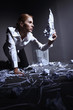 Businesswoman looking at opened crumpled paper