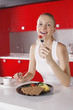 Woman eating cherry tomato