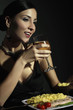 Photo: Woman drinking wine while enjoying pan-fried fish fillet with buttered rice and fresh herbs Woman drinking wine while enjoying pan-fried fish fillet with buttered rice and fresh herbs