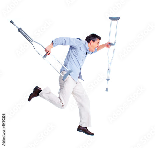 Photo: Man with crutch. Man with crutch.