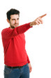 happy young man pointing at something interesting over white bac happy young man pointing at something interesting over white bac