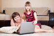 women using laptop in home women using laptop in home