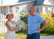 man and woman infront of   house