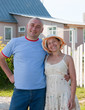 adult man and woman near gate of  home