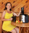 woman with juicer machine