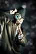 Photo: Man Looking Through Magnifying Glass Man Looking Through Magnifying Glass