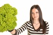 young attractive woman eating salad close up