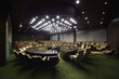 Details der Fotografie Auditorium with  round oak table and beige armchairs