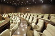 Rows of armchairs in the meeting room.