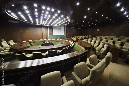 Photo: Auditorium for the meeting with round table, rostrum and chairs Auditorium for the meeting with round table, rostrum and chairs