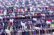 Large clothing store, many rows with hangers, variety of sizes