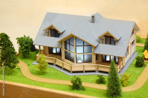 Photo: Small model of cottage with exterior - trees, bushes and path Small model of cottage with exterior - trees, bushes and path