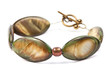 Bracelet with green and gold oval stones on white