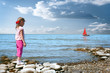 Foto: little girl wait boat little girl wait boat