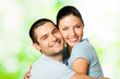 Portrait of young smiling couple, outdoors