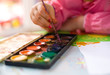 Little girl's hand with painting brush