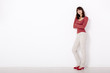Woman against a white wall