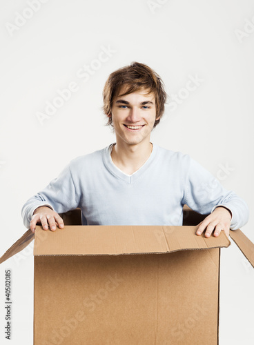 Photo: Man inside a card box Man inside a card box