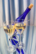 Photo: Two crystal glasses of wine and blue bottle Two crystal glasses of wine and blue bottle