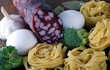 tagliatelle pasta ingredients on wooden board