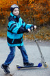Boy driving a scooter