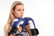 Beautiful young woman with boxing gloves