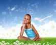 Smiling girl on green grass