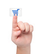 Finger presses button with icon cart.