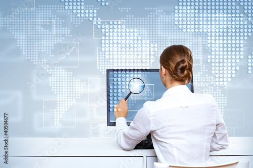 Photo: Businesswoman working with virtual digital screens Businesswoman working with virtual digital screens