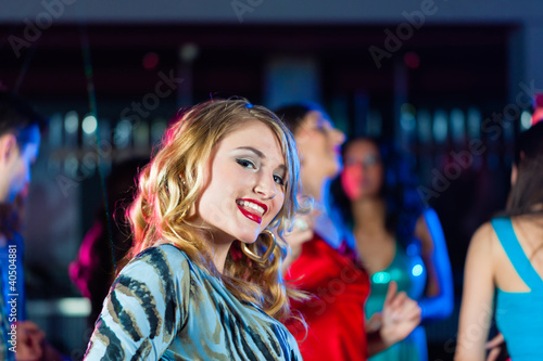 Photo: Party people dancing in disco or club Party people dancing in disco or club