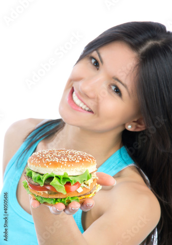 Photo: Woman with unhealthy burger in hand Woman with unhealthy burger in hand