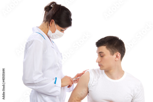 Photo: Doctor make flu vaccination or insulin injection shot Doctor make flu vaccination or insulin injection shot